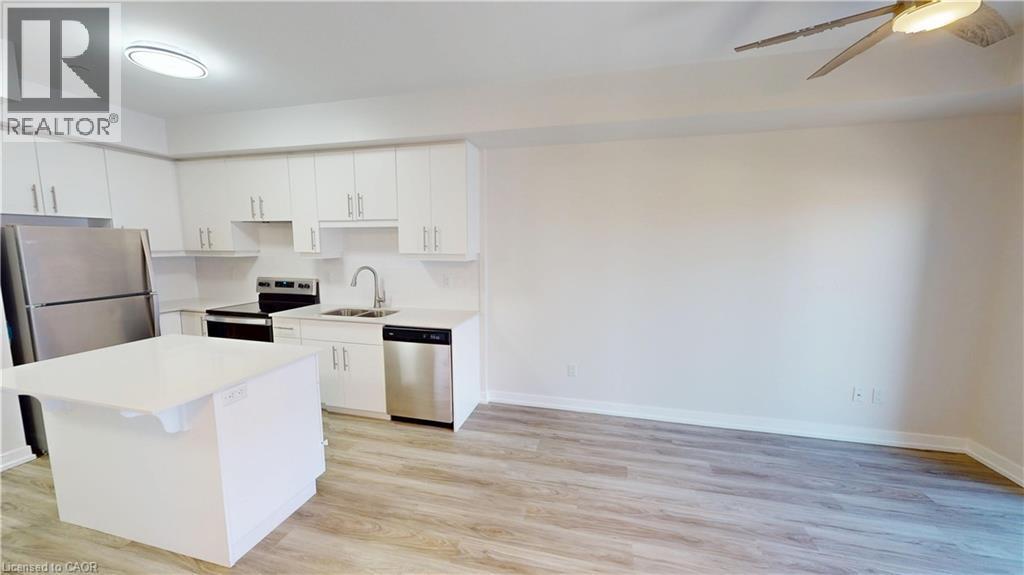 251 Northfield Drive E Unit# 410, Waterloo, ON - Indoor Photo Showing Kitchen With Stainless Steel Kitchen With Double Sink