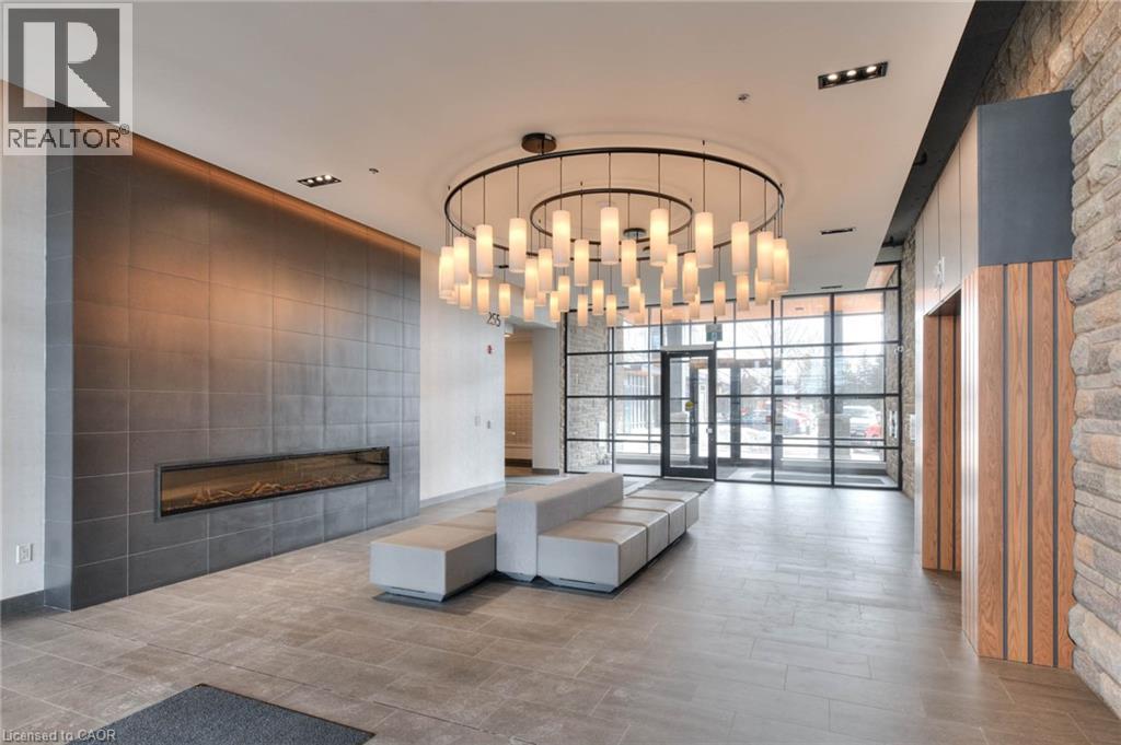 251 Northfield Drive E Unit# 410, Waterloo, ON - Indoor Photo Showing Other Room With Fireplace