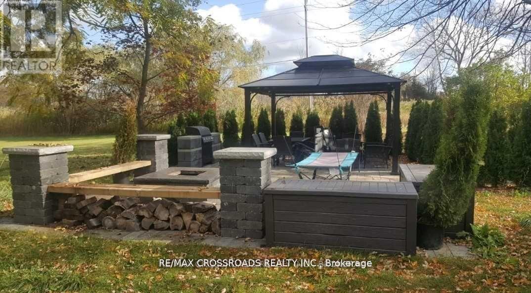 backyard (trees have been removed) - 7118 Yonge Street, Innisfil, ON - Outdoor With Deck Patio Veranda