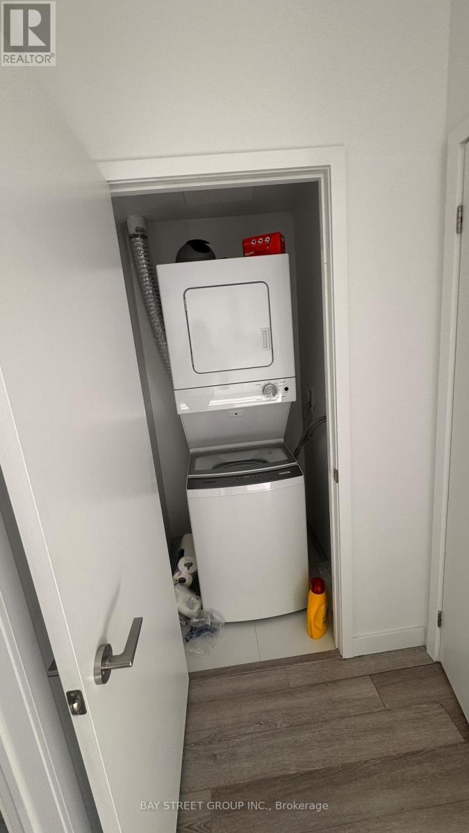 2115 - 230 Simcoe Street, Toronto, ON - Indoor Photo Showing Laundry Room