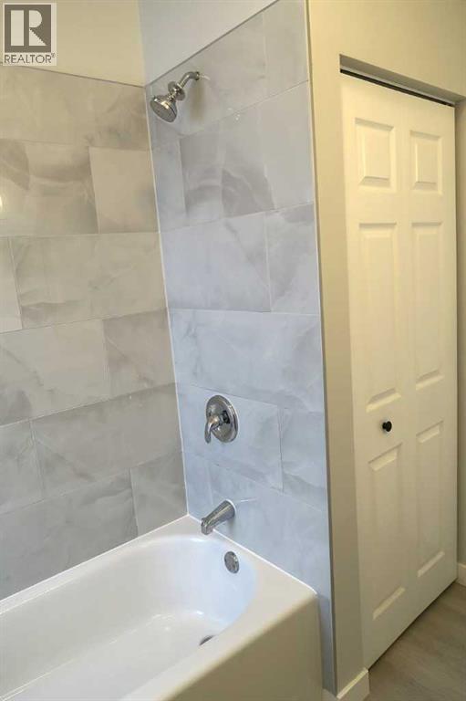 Closet in Bathroom ,Tile Tub Surround - 111 6 Avenue Se, Three Hills, AB