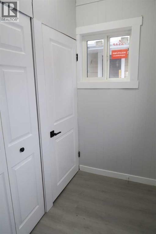 Rear Foyer Entry . NEW Window - 111 6 Avenue Se, Three Hills, AB