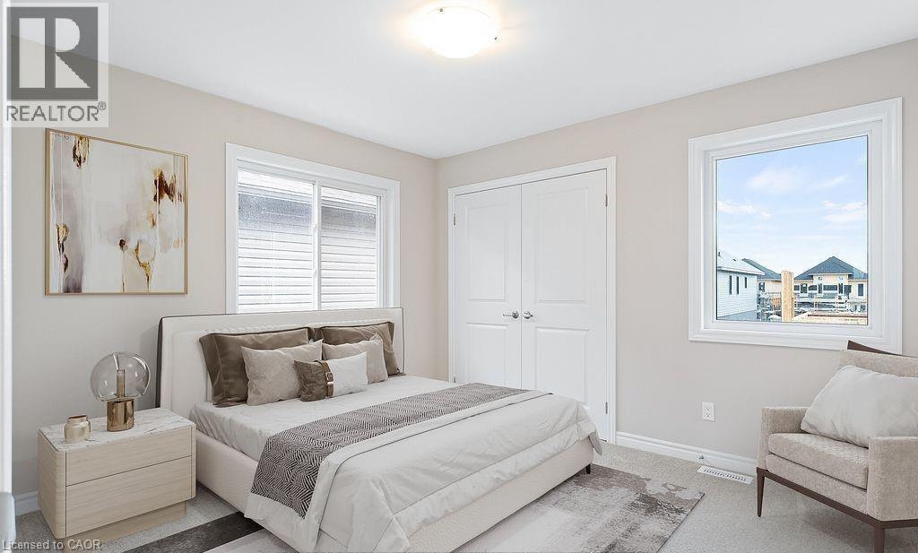 Bedroom with carpet flooring and a closet - 103 Mclaughlin Street, Welland, ON - Indoor Photo Showing Bedroom