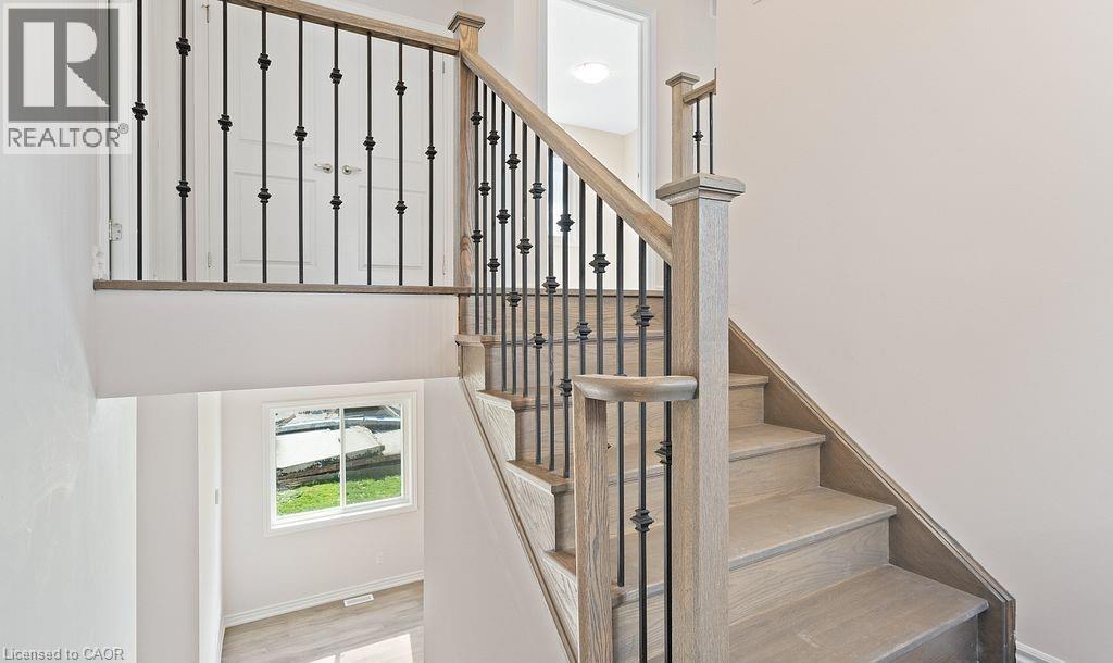 Stairway with wood finished floors and baseboards - 103 Mclaughlin Street, Welland, ON - Indoor Photo Showing Other Room