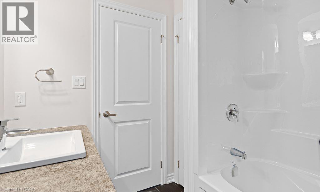 Bathroom featuring shower / washtub combination and vanity - 103 Mclaughlin Street, Welland, ON - Indoor Photo Showing Bathroom
