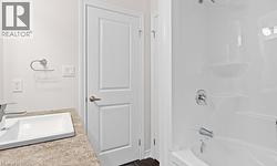 Bathroom featuring shower / washtub combination and vanity -