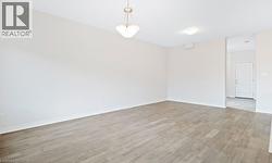 Unfurnished room featuring light wood-style floors -