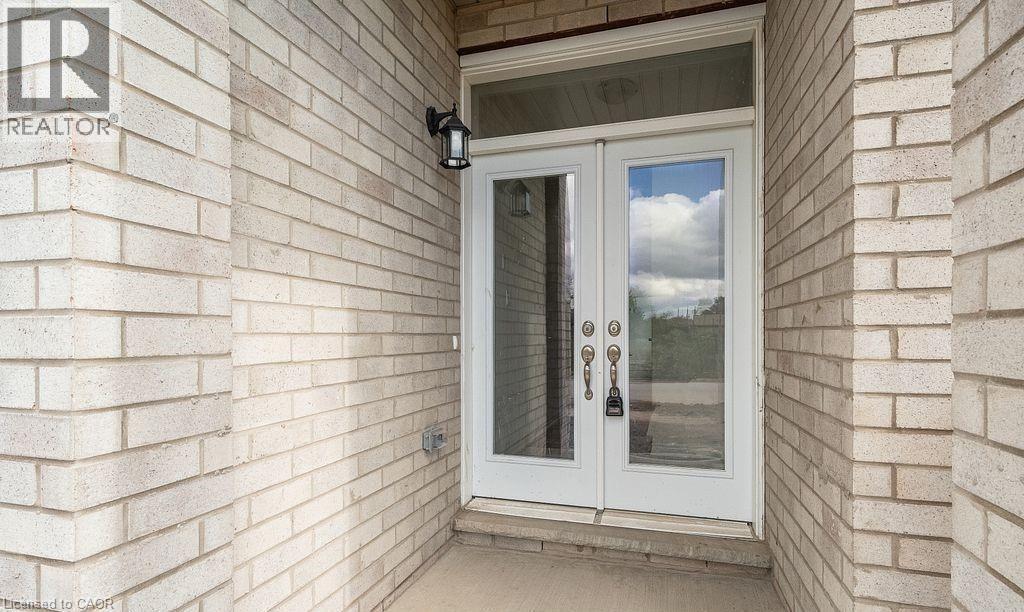 Doorway to property featuring french doors and brick siding - 103 Mclaughlin Street, Welland, ON - Outdoor With Exterior