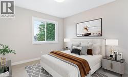 Bedroom featuring baseboards and light carpet -