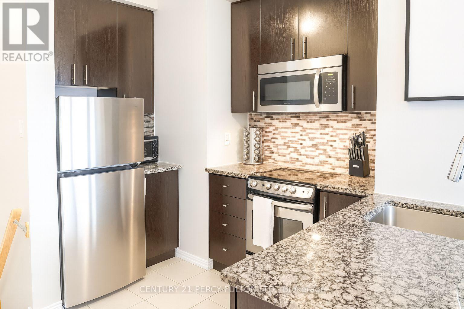 257 - 19 Coneflower Crescent, Toronto, ON - Indoor Photo Showing Kitchen With Stainless Steel Kitchen With Upgraded Kitchen