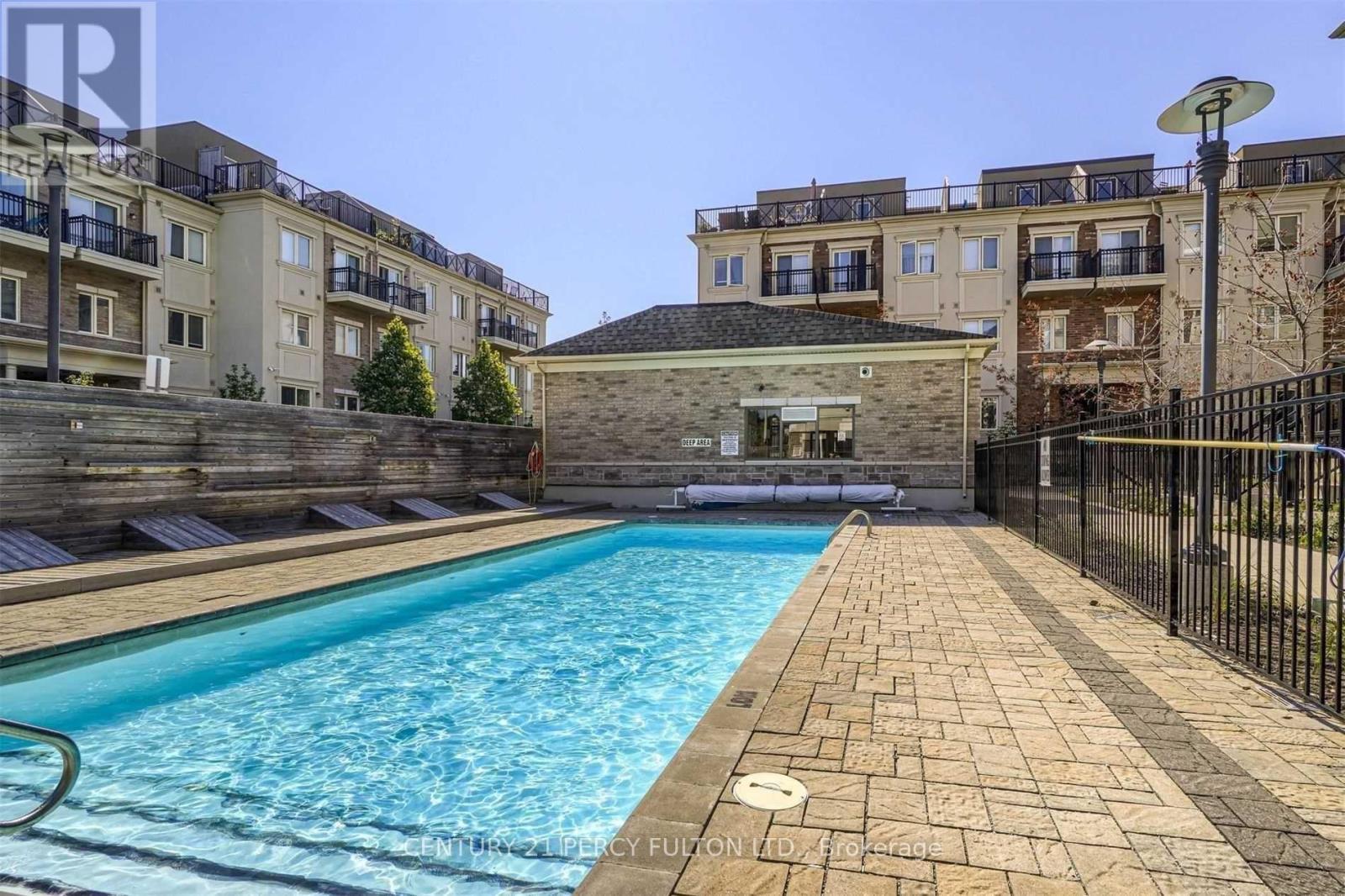 257 - 19 Coneflower Crescent, Toronto, ON - Outdoor With In Ground Pool With Balcony