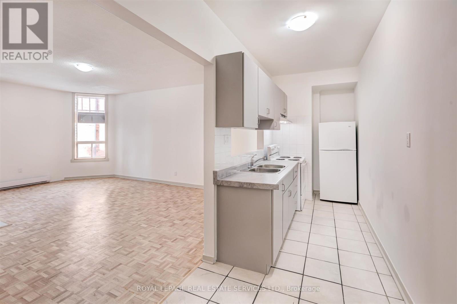 102 - 1530 King Street W, Toronto, ON - Indoor Photo Showing Kitchen With Double Sink