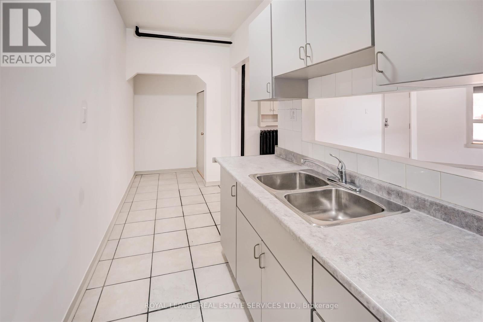 102 - 1530 King Street W, Toronto, ON - Indoor Photo Showing Kitchen With Double Sink