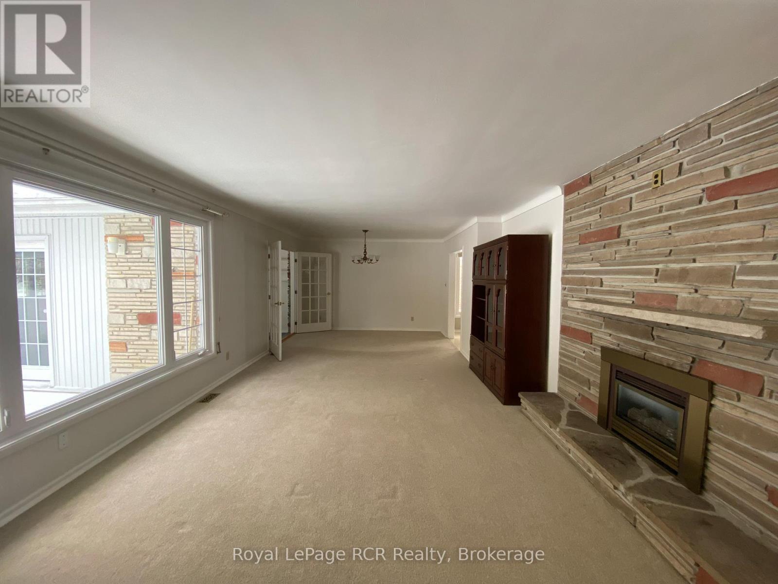 149 7Th Avenue E, Owen Sound, ON - Indoor Photo Showing Other Room With Fireplace