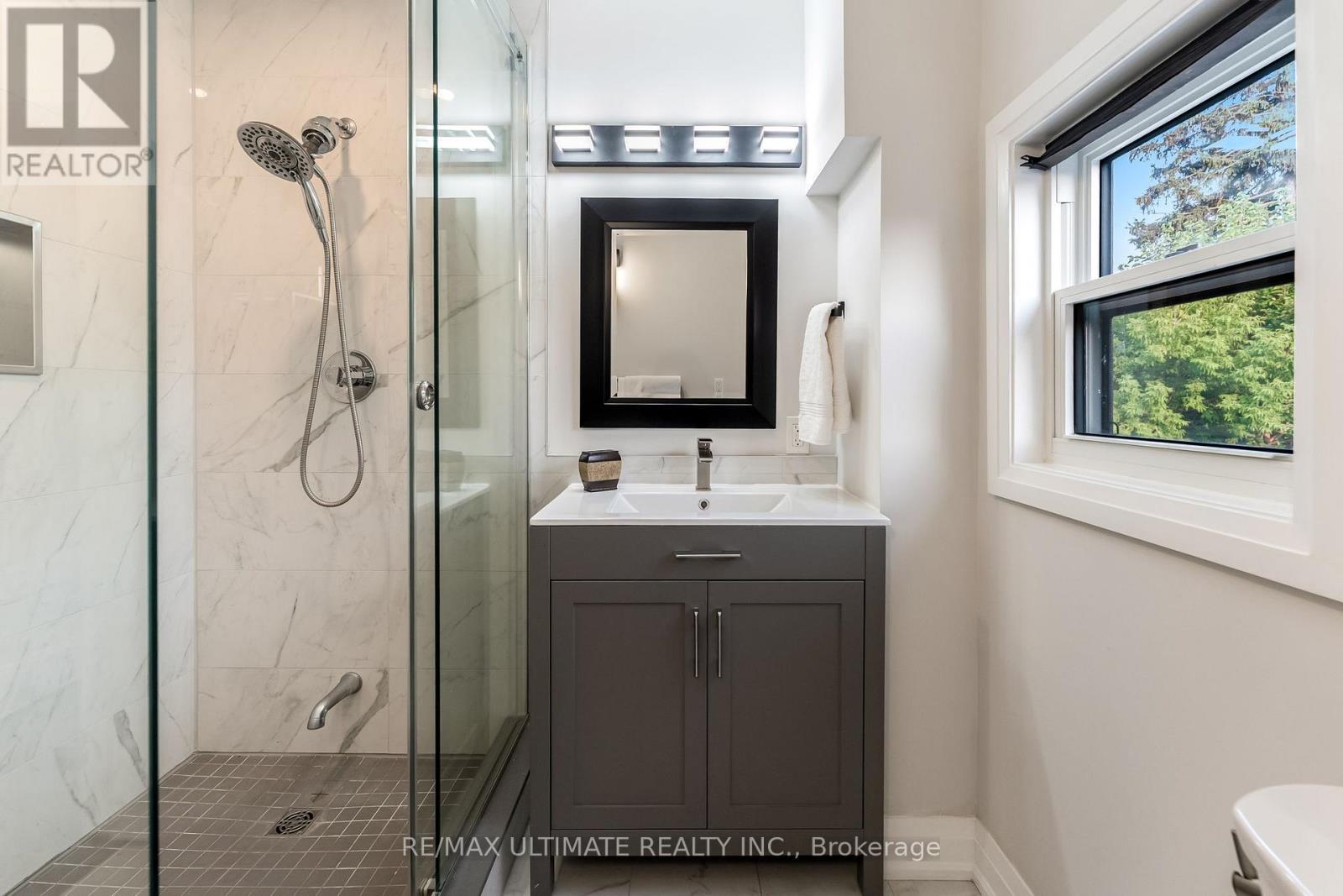 Convenience of shower head and extra lower faucet - 47 Mahoney Avenue, Toronto, ON - Indoor Photo Showing Bathroom