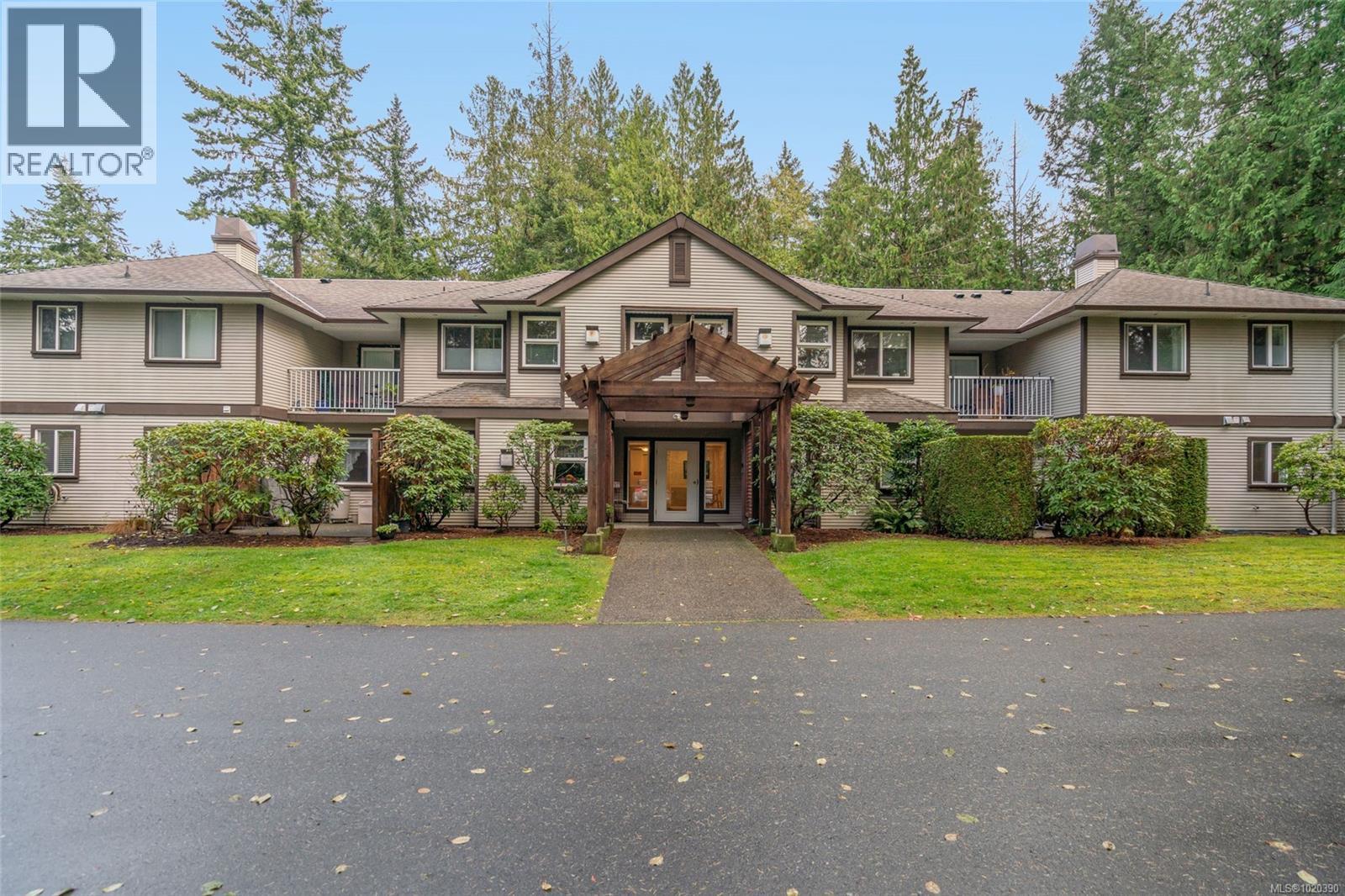 205 440 Schley Pl, Qualicum Beach, BC - Outdoor With Balcony With Facade