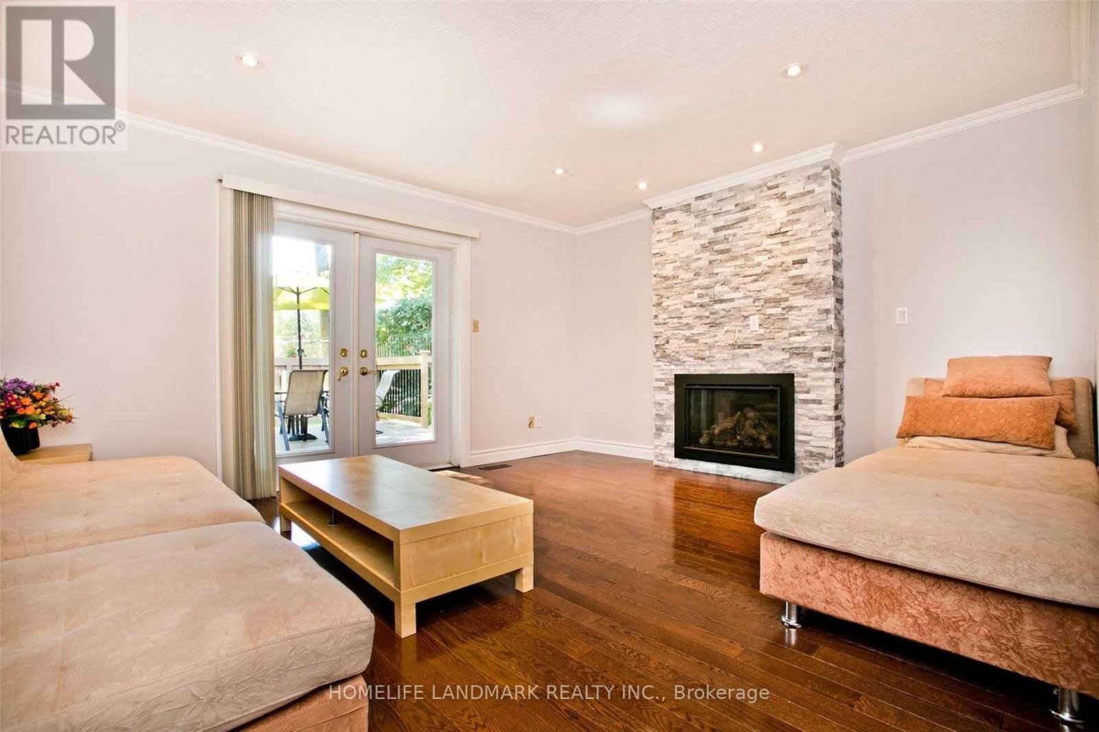 17 Caravan Drive, Toronto, ON - Indoor Photo Showing Living Room With Fireplace