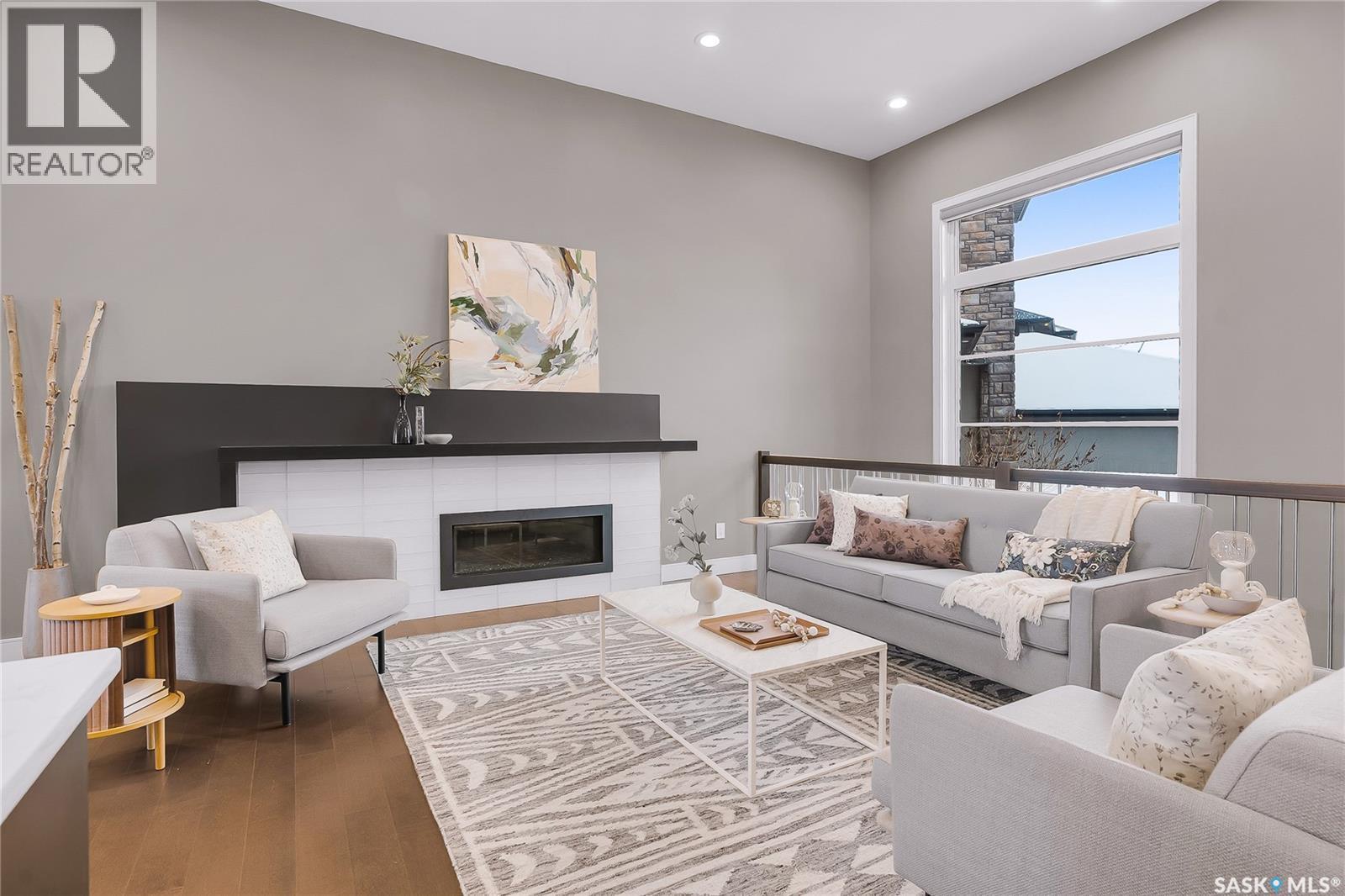 137 Gillies Bay, Saskatoon, SK - Indoor Photo Showing Living Room With Fireplace