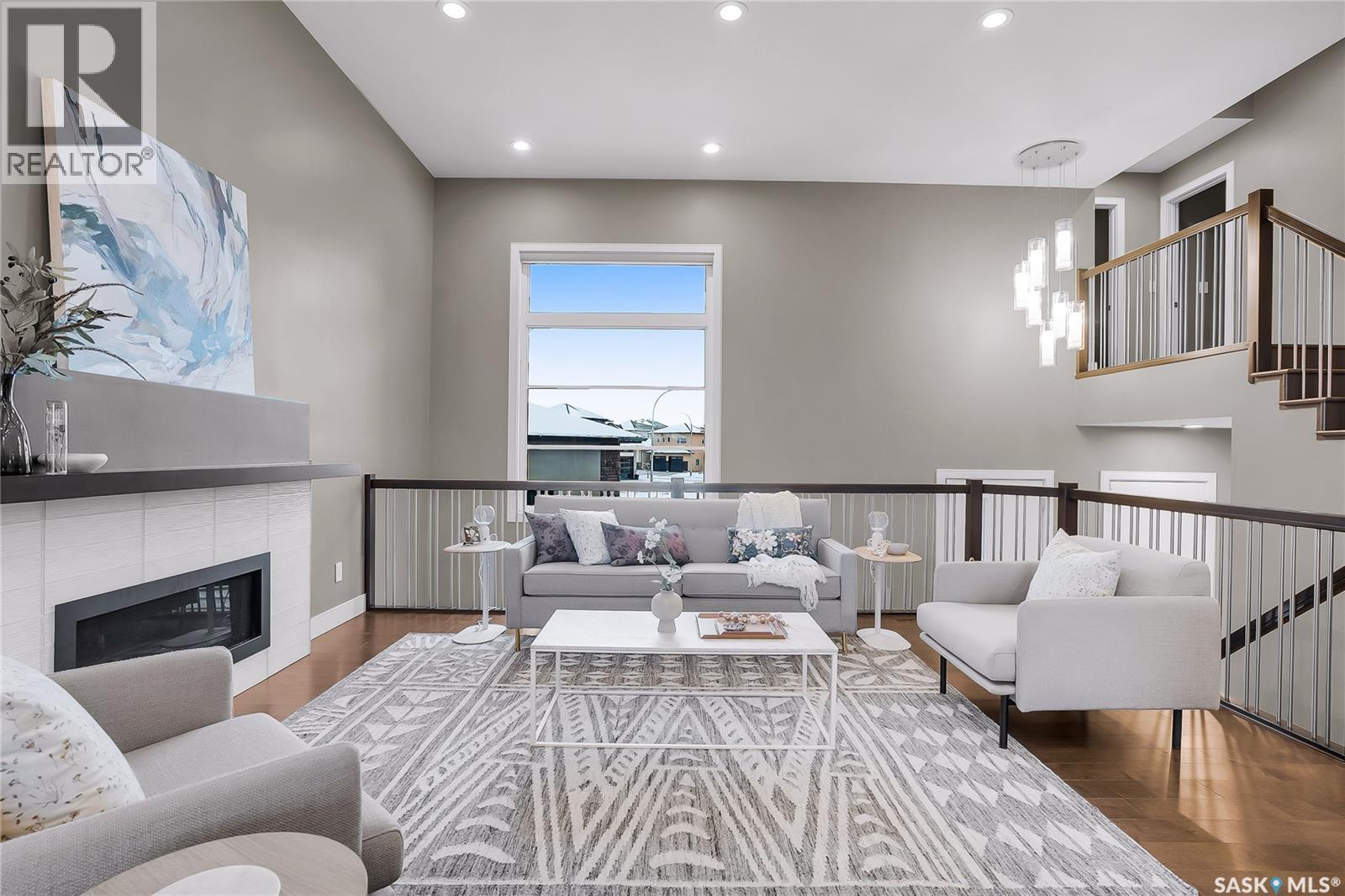 137 Gillies Bay, Saskatoon, SK - Indoor Photo Showing Other Room With Fireplace