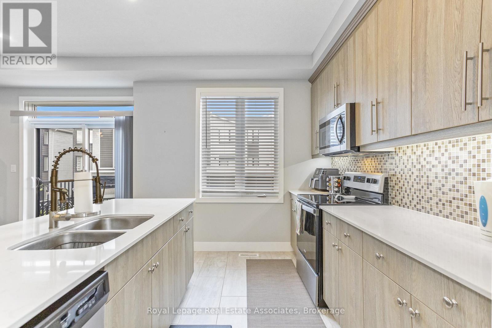 16 - 177 Edgevalley Road, London East, ON - Indoor Photo Showing Kitchen With Double Sink