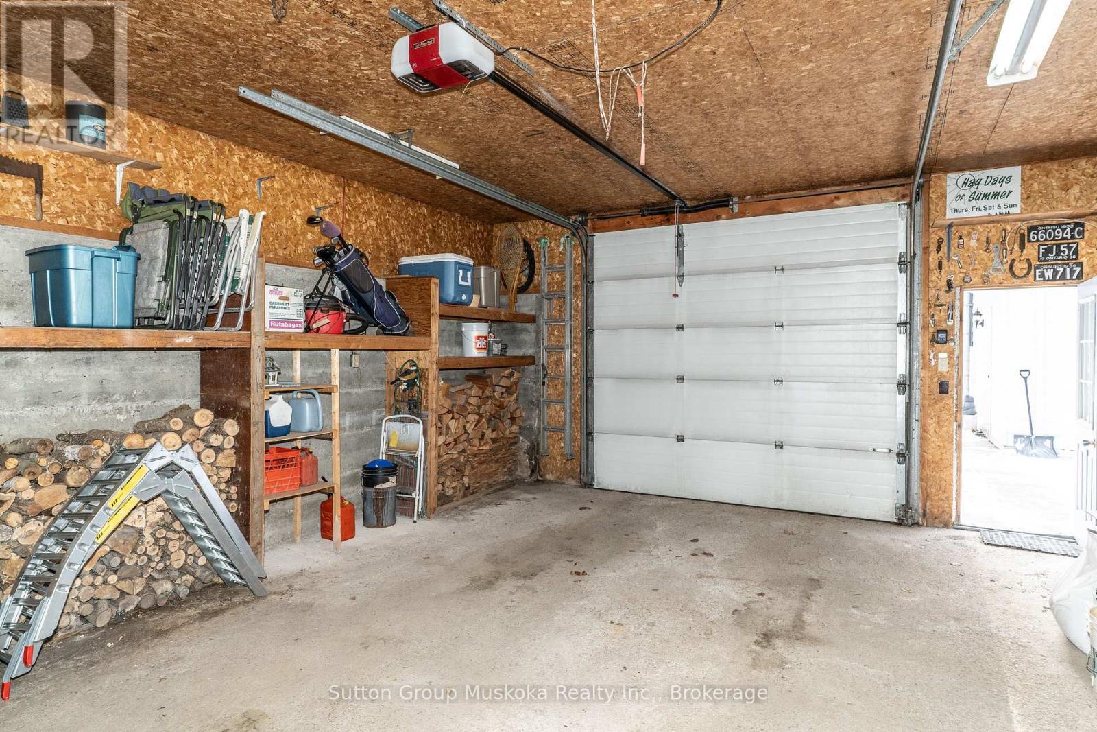 Inside Large Garage (20 x 30) - 64 Spruce Drive, Huntsville (Stephenson), ON - Indoor Photo Showing Garage