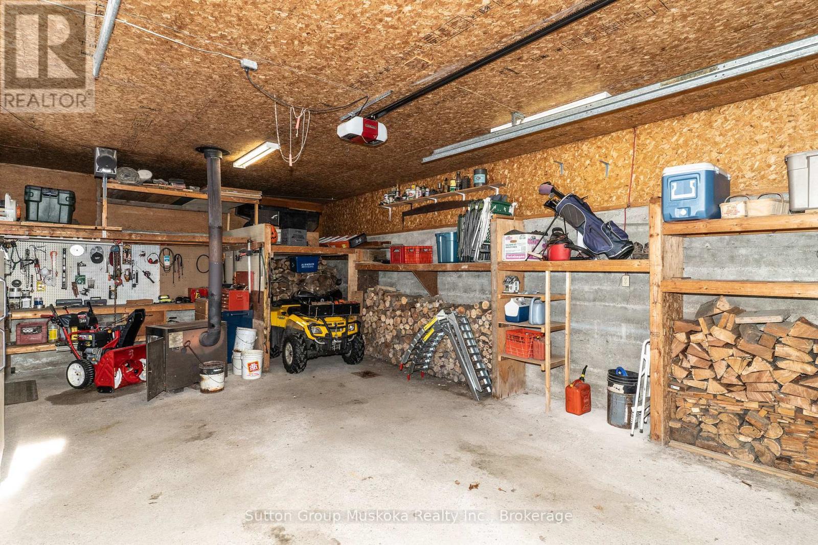 Inside Shop/Garage - 64 Spruce Drive, Huntsville (Stephenson), ON - Indoor Photo Showing Garage