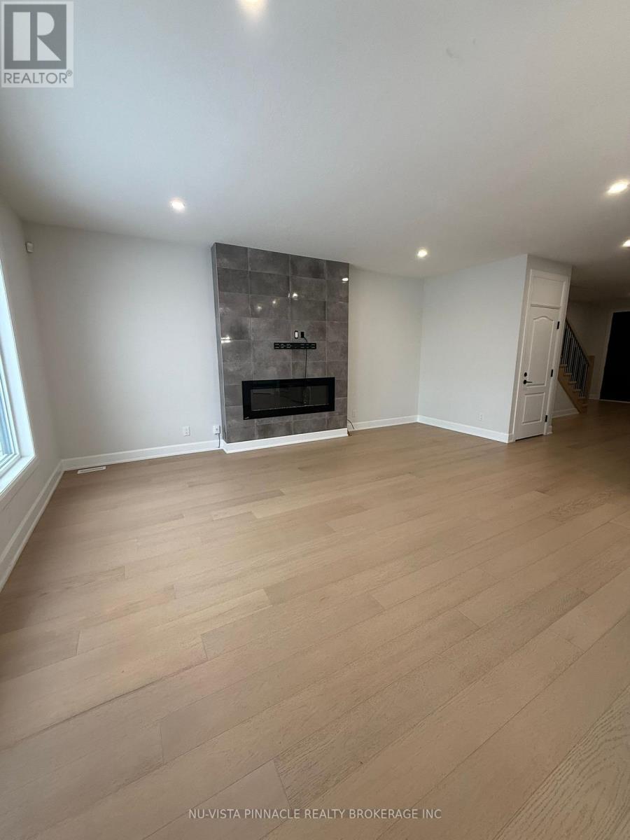 2596 Buroak Drive, London North (North S), ON - Indoor With Fireplace