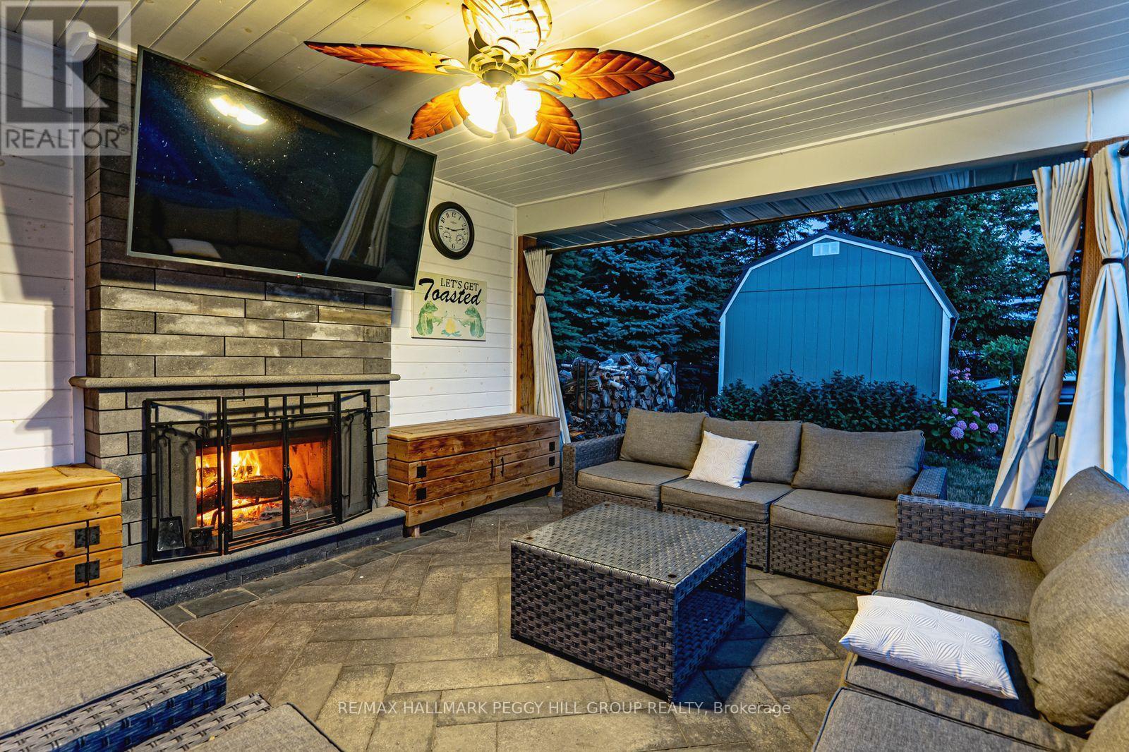 5 Munro Court, Springwater, ON - Indoor Photo Showing Living Room With Fireplace