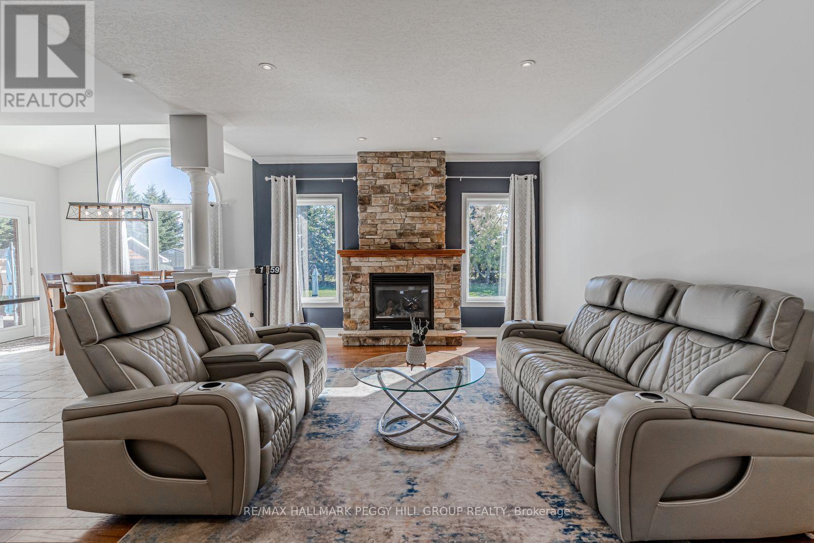 5 Munro Court, Springwater, ON - Indoor Photo Showing Living Room With Fireplace