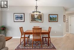 Dining space with light wood finished floors -