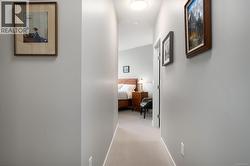 Hall with carpet floors and baseboards -