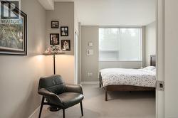 Bedroom featuring carpet flooring and baseboards -