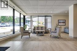 Lobby featuring a drop ceiling and recessed lighting -