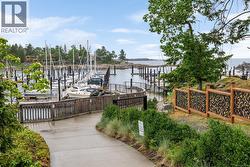 Dock area with a water view and boat lift -