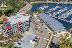 Drone / aerial view of a nearby body of water and numerous boat docks -