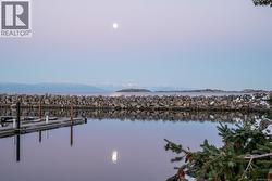 Dock featuring a water view -