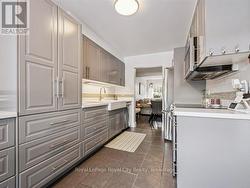 15 rollout drawers and 14 upper cabinet doors -