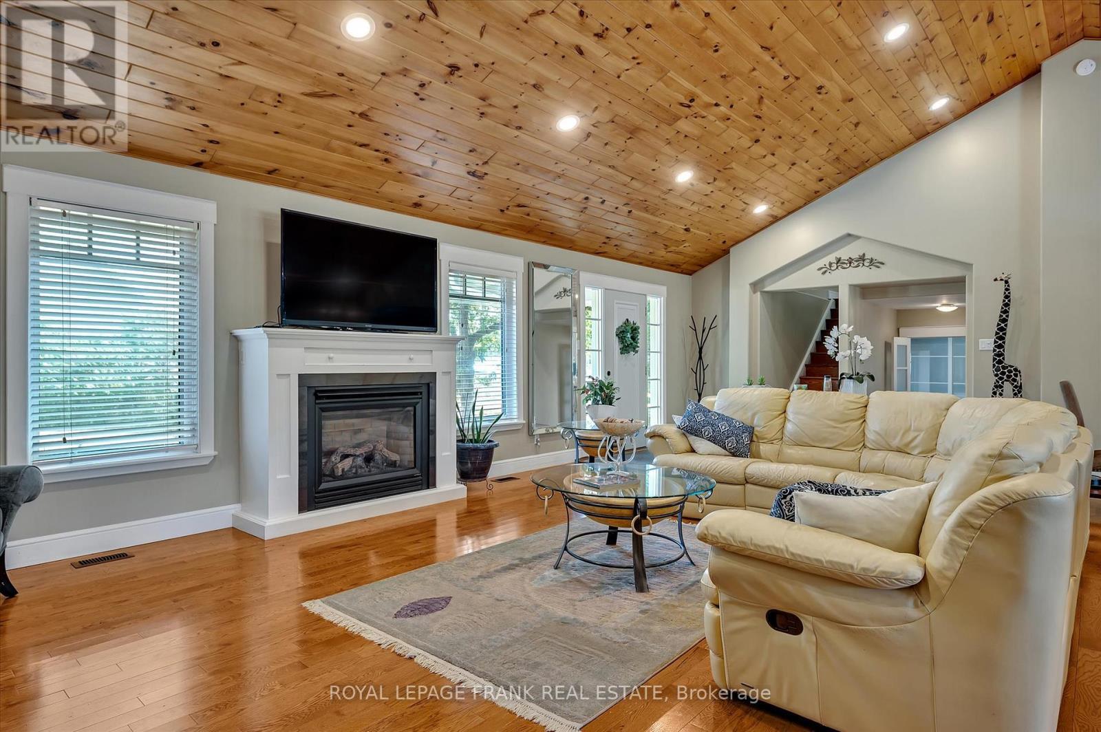 1898 Lakehurst Road, Trent Lakes, ON - Indoor Photo Showing Living Room With Fireplace