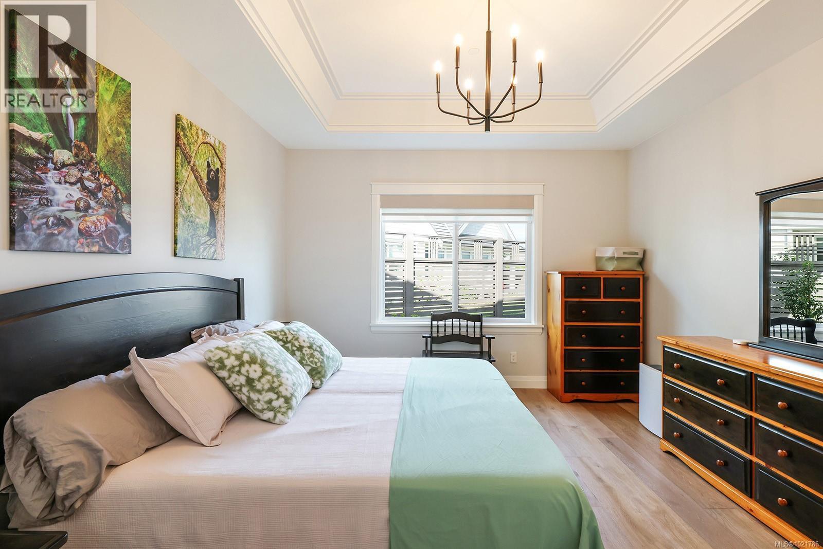 115 1444 Crown Isle Dr, Courtenay, BC - Indoor Photo Showing Bedroom