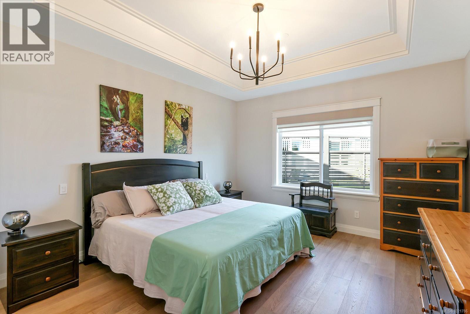 115 1444 Crown Isle Dr, Courtenay, BC - Indoor Photo Showing Bedroom