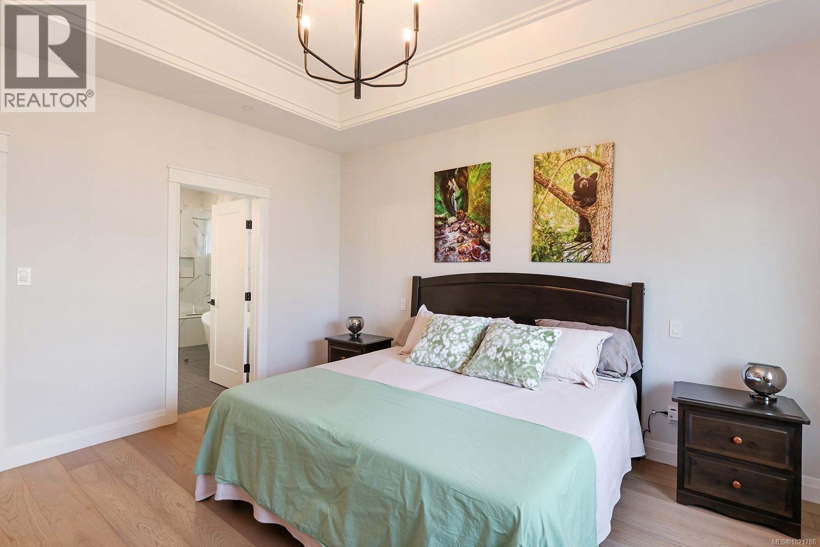 115 1444 Crown Isle Dr, Courtenay, BC - Indoor Photo Showing Bedroom