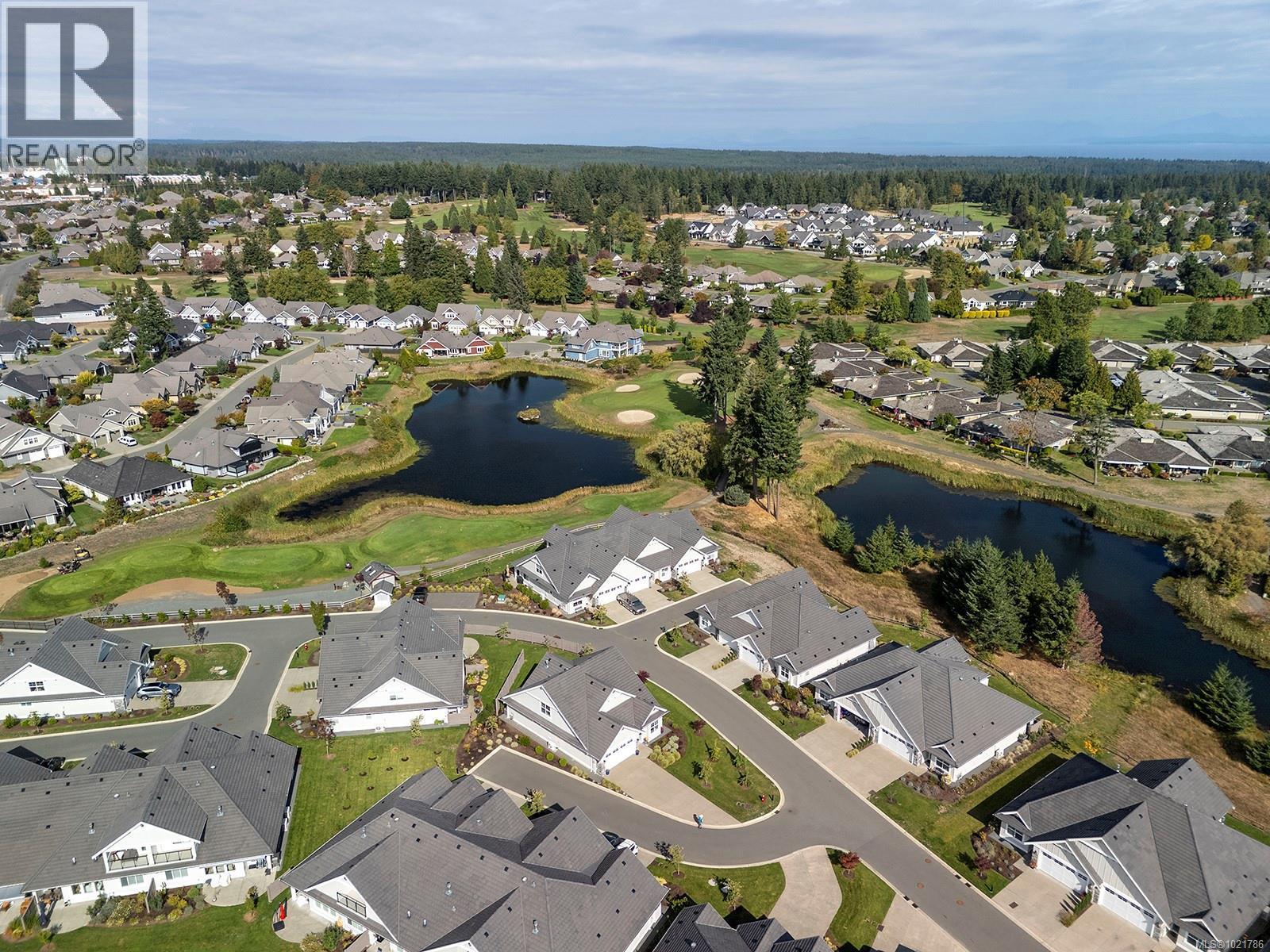 115 1444 Crown Isle Dr, Courtenay, BC - Outdoor With Body Of Water With View
