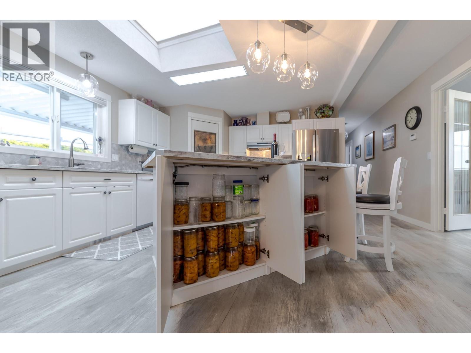 3 Extra cabinets along the back of the island - 8598 Hwy 97 Unit# 50, Oliver, BC