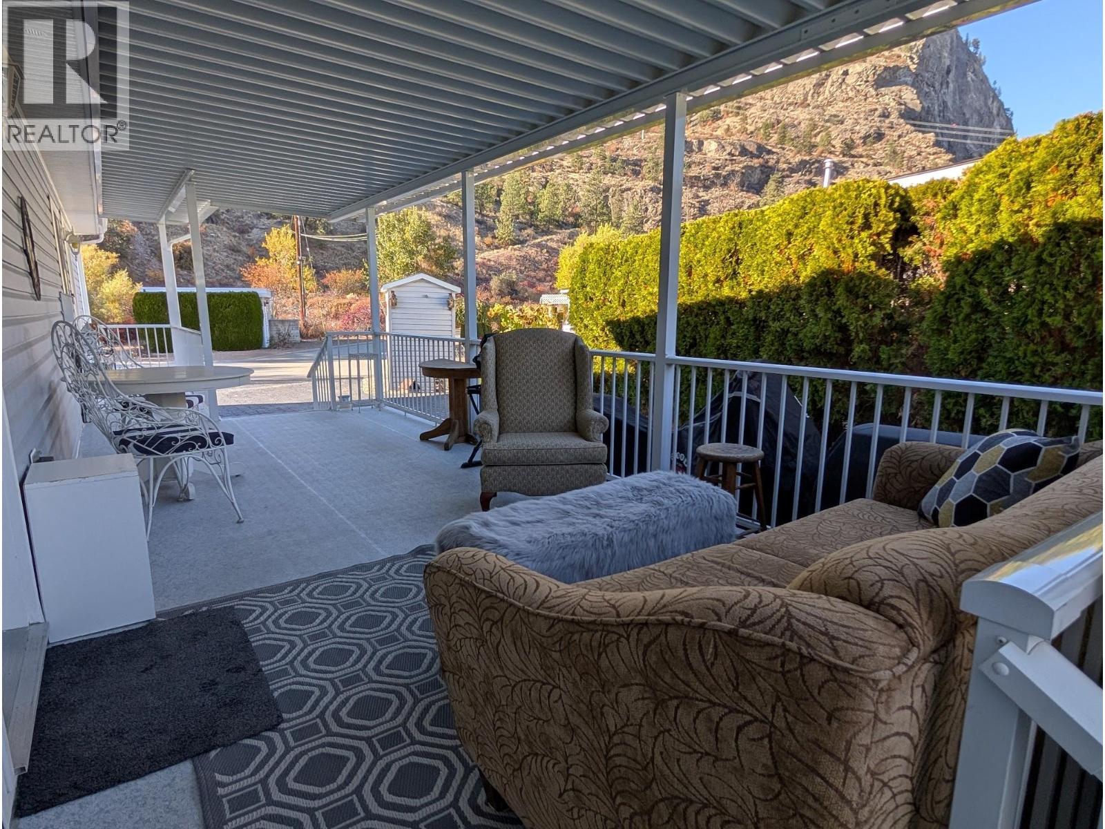 Generous North facing Covered Deck in the Shade :) - 8598 Hwy 97 Unit# 50, Oliver, BC