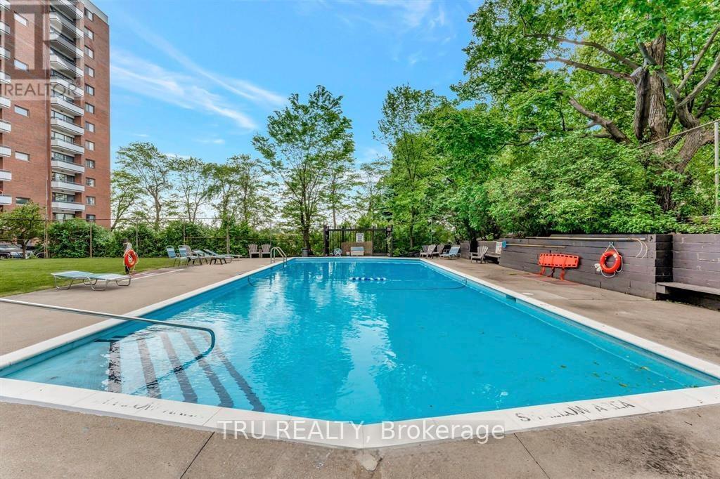 209 - 20 Chesterton Drive, Ottawa, ON - Outdoor With In Ground Pool