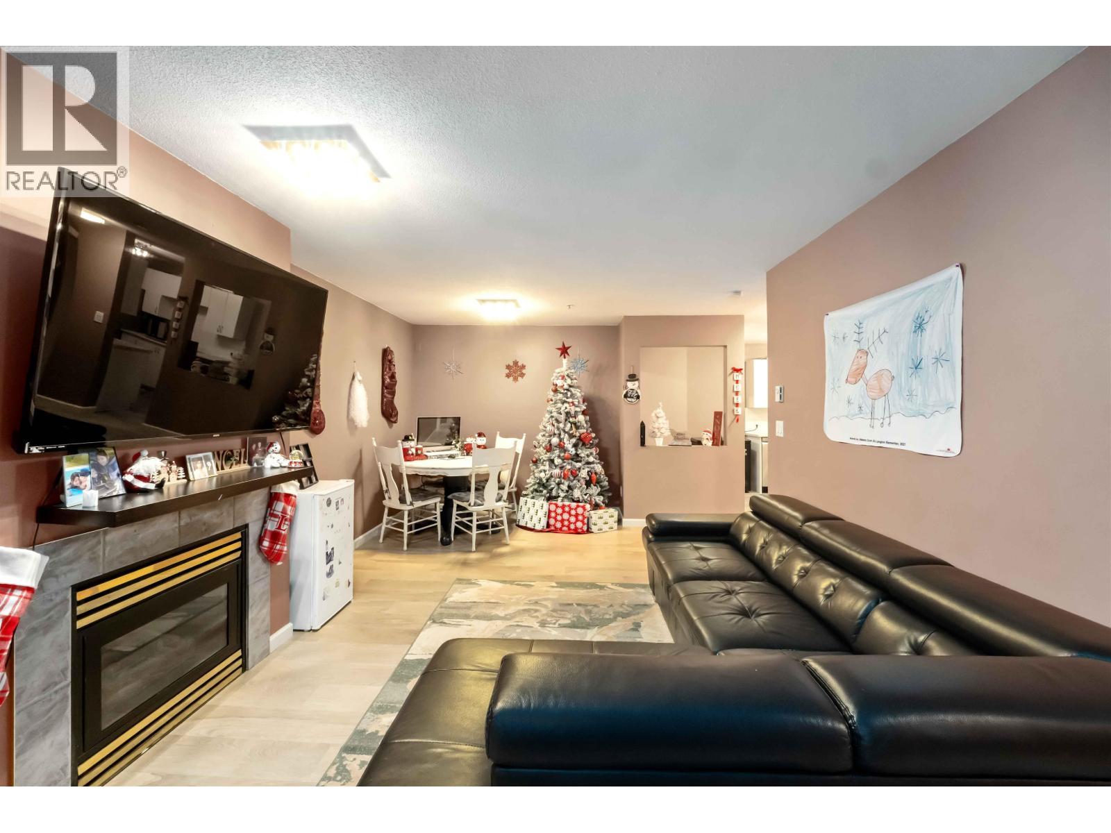 401 22351 St Anne Avenue, Maple Ridge, BC - Indoor Photo Showing Living Room With Fireplace