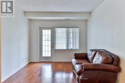 Living room with walk-out to sunroom -