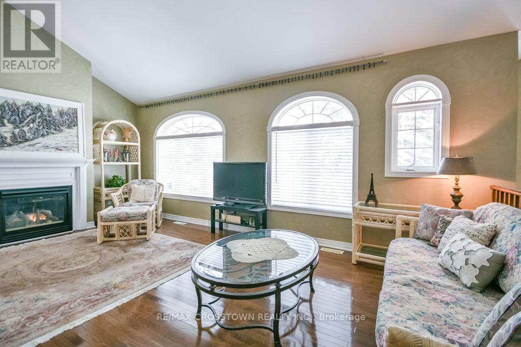 25 Cunningham Drive, Essa, ON - Indoor Photo Showing Living Room With Fireplace