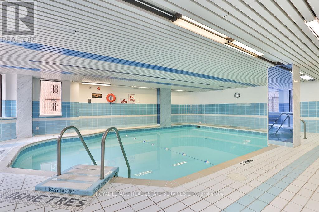 708 - 100 Lakeshore Road E, Oakville, ON - Indoor Photo Showing Other Room With In Ground Pool