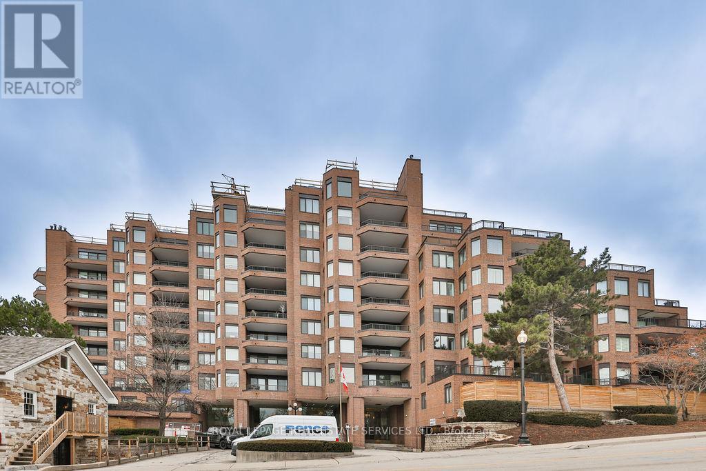 708 - 100 Lakeshore Road E, Oakville, ON - Outdoor With Balcony With Facade